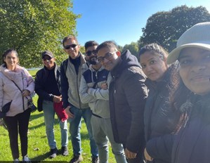 7 of our office staff posing for a picture under bright sun