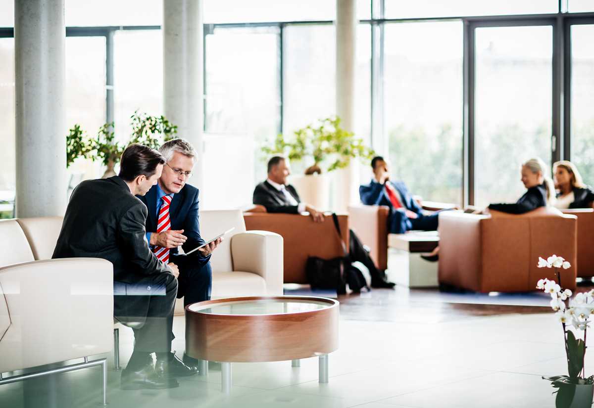 People engaged in professional discussions in a Legal office