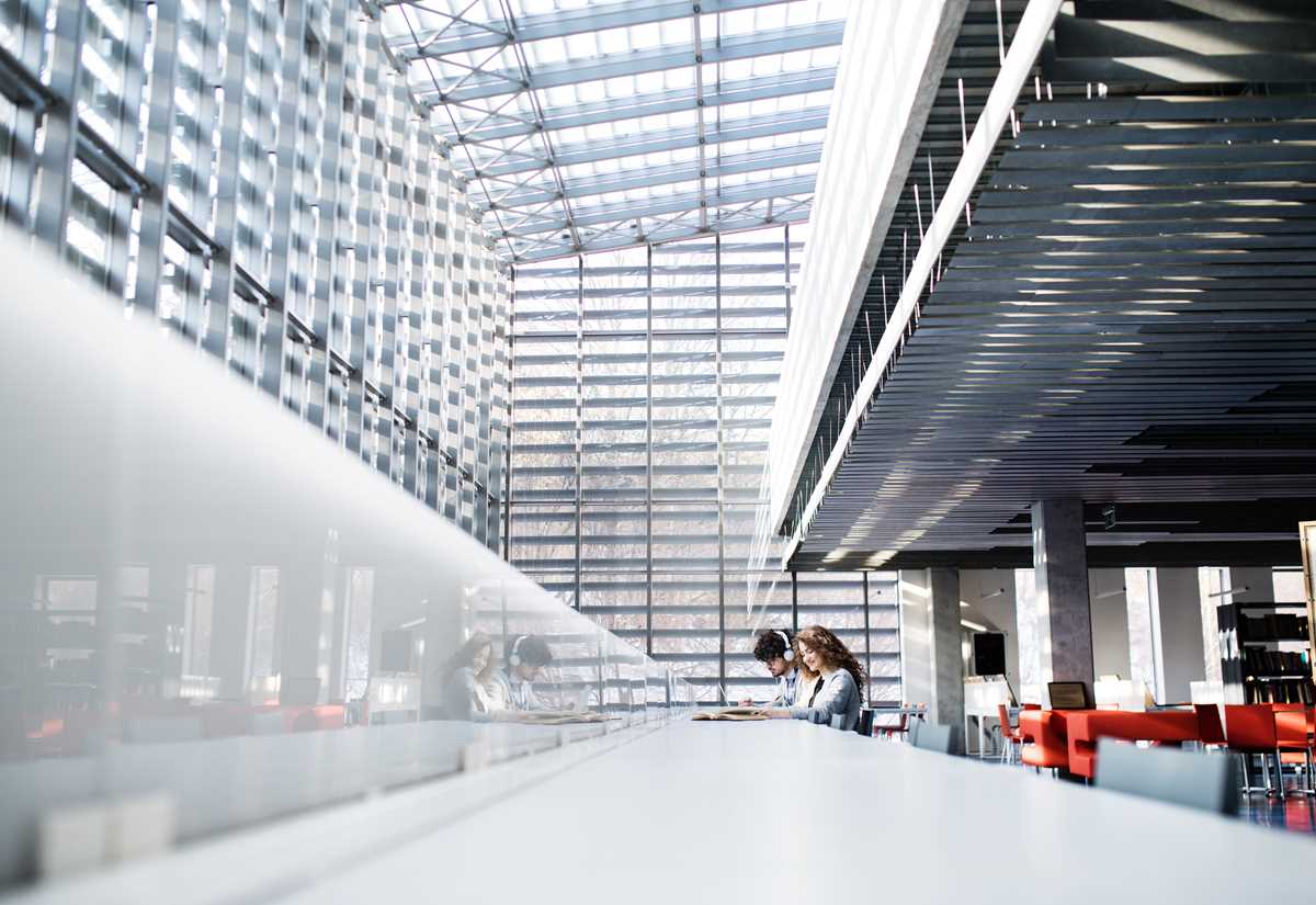Inside a university building with students engaged in their work