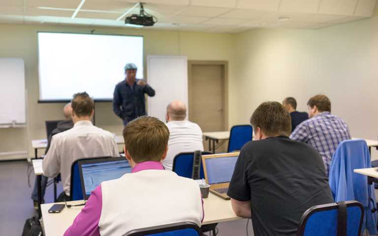 Software testing training delegates in a classroom