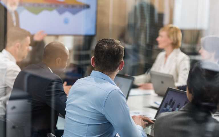 A management team around a meeting table